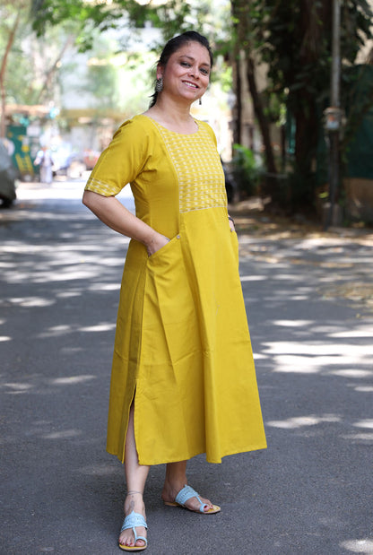 A Line Handloom Yellow Cotton Kurti With Ikat Yoke & Pockets